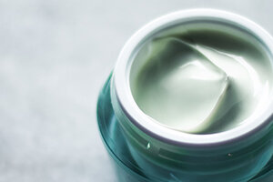 body lotion in small glass